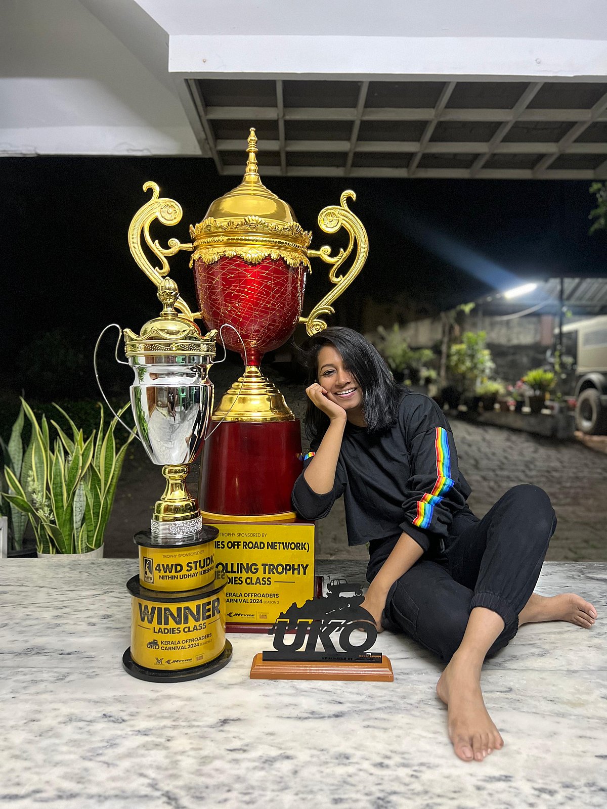 Aparna poses with her awards from off-roading competitions